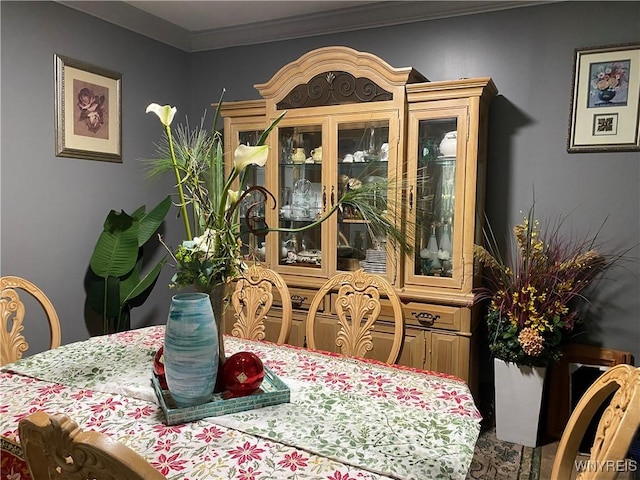 dining room featuring crown molding