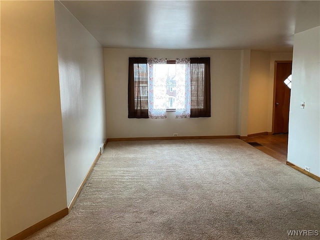 empty room featuring light colored carpet