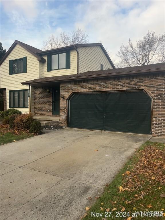 view of front of property with a garage