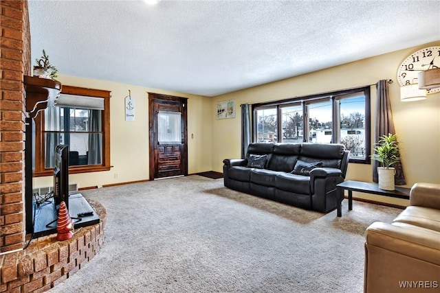 carpeted living room with a textured ceiling