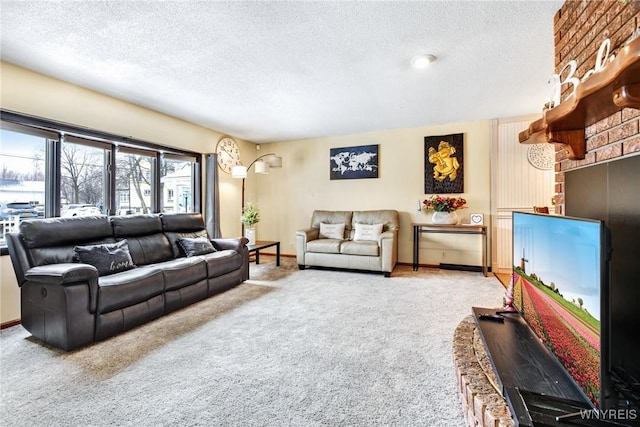 carpeted living room featuring a textured ceiling