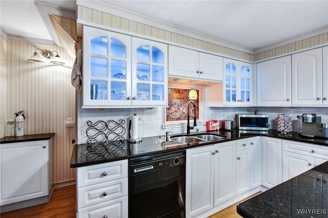 kitchen with sink, dishwasher, white cabinets, dark stone counters, and backsplash