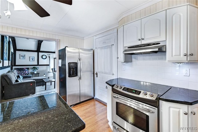 kitchen featuring decorative backsplash, light hardwood / wood-style flooring, stainless steel appliances, and white cabinets