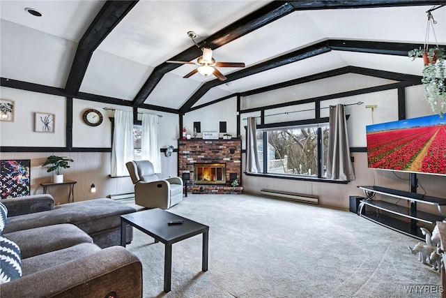 carpeted living room with a brick fireplace, vaulted ceiling with beams, ceiling fan, and a baseboard heating unit