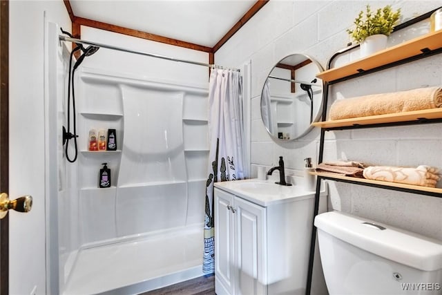 bathroom featuring vanity, toilet, and walk in shower