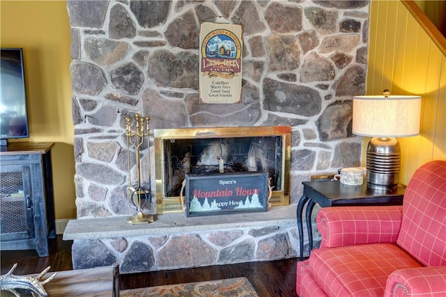 living room featuring a fireplace and wood-type flooring