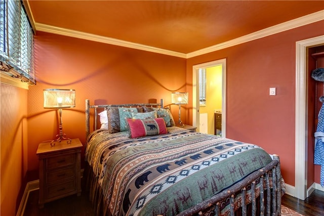 bedroom with ornamental molding and dark wood-type flooring