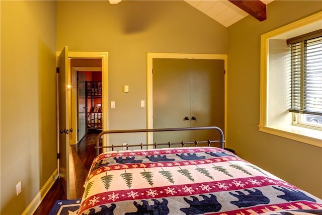 bedroom featuring lofted ceiling with beams and dark hardwood / wood-style floors