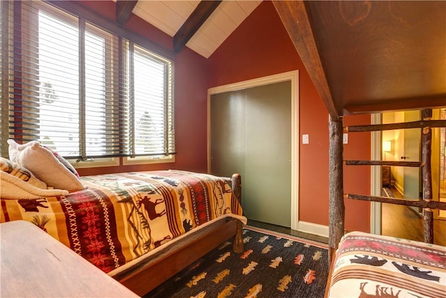 bedroom with wood ceiling and lofted ceiling with beams