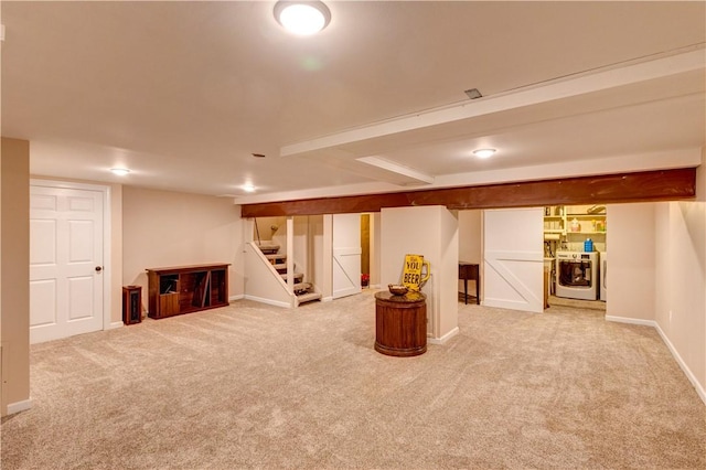 basement with carpet flooring and washer / dryer