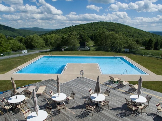 view of pool with a yard and a patio area