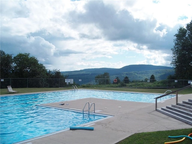 view of pool with a mountain view