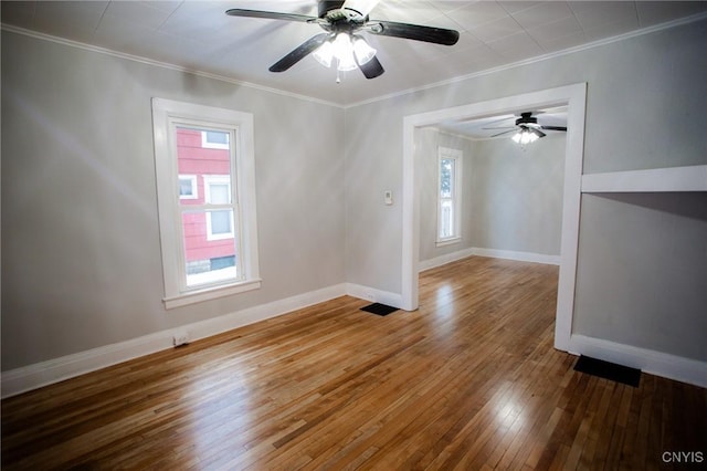 416 Broadway Ave E, Watertown-City, NY 13601 - spare room with crown molding, hardwood / wood-style floors, ceiling fan, and baseboards