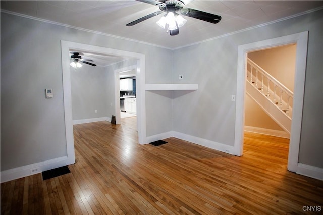 416 Broadway Ave E, Watertown-City, NY 13601 - unfurnished room with ceiling fan, ornamental molding, hardwood / wood-style floors, stairway, and baseboards
