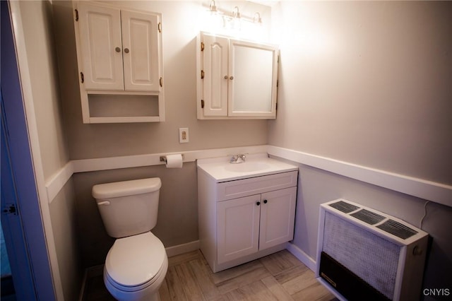 416 Broadway Ave E, Watertown-City, NY 13601 - half bath featuring heating unit, vanity, toilet, and baseboards