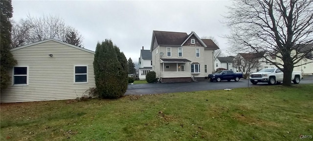 view of home's exterior featuring a lawn