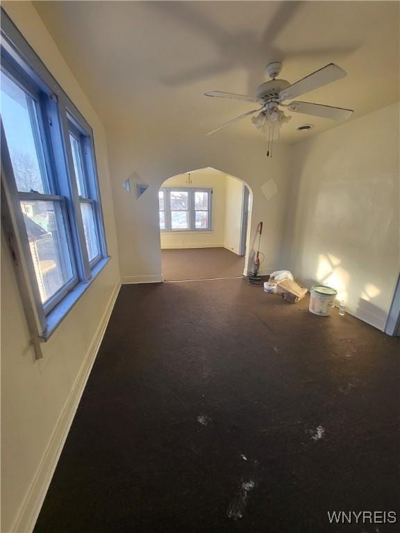 interior space featuring ceiling fan