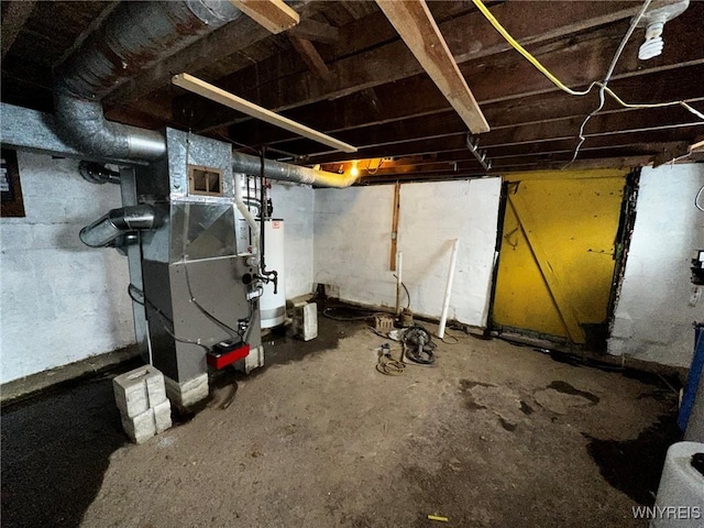 basement with heating unit and water heater