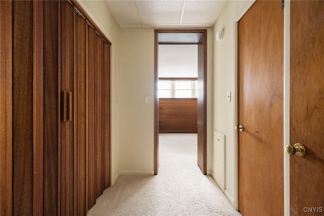 hallway featuring light carpet