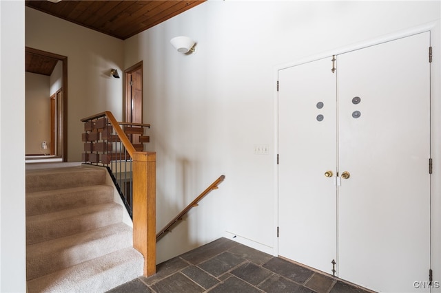 stairs featuring wood ceiling