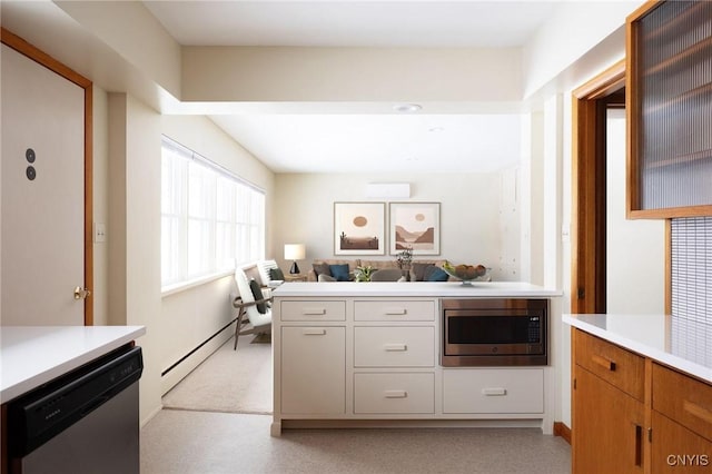 kitchen with stainless steel appliances and a baseboard heating unit