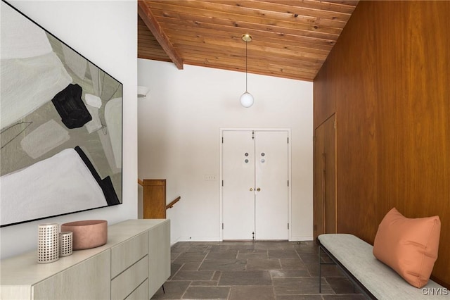 entryway with high vaulted ceiling and wood ceiling