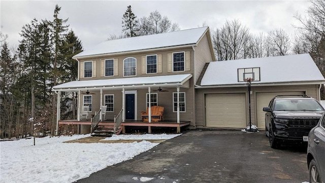 view of front of house featuring a porch and a garage