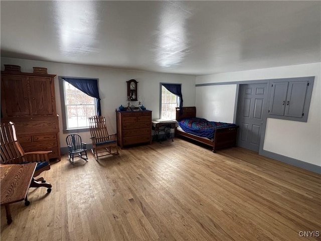 bedroom with light wood-type flooring