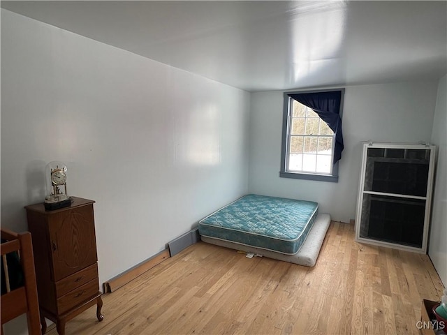 bedroom with light wood-type flooring