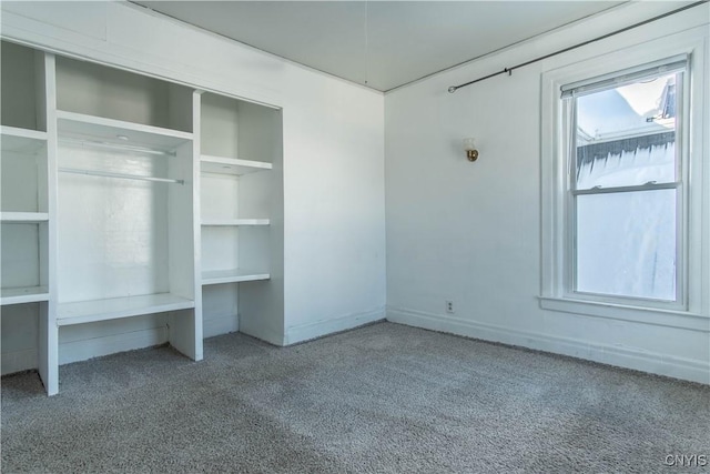 unfurnished bedroom featuring light carpet