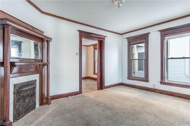 unfurnished living room with carpet floors and crown molding