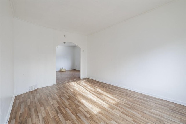 spare room featuring light hardwood / wood-style floors