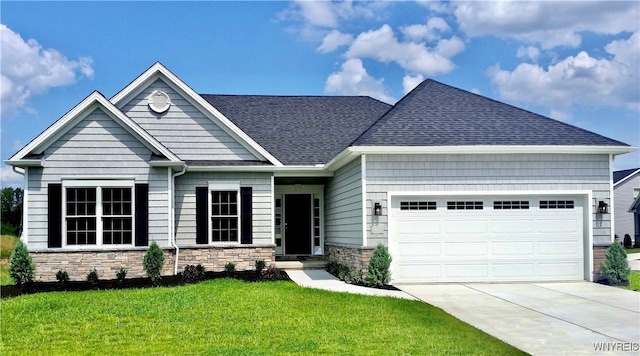 craftsman-style home with a garage and a front lawn