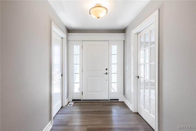 foyer featuring dark hardwood / wood-style floors