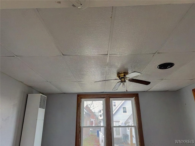 interior details featuring ceiling fan