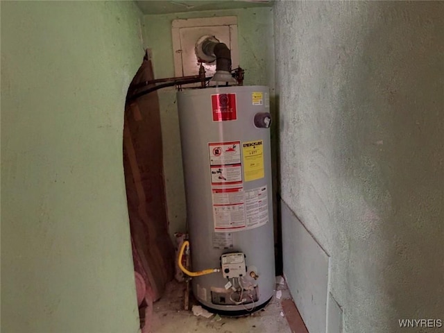 utility room featuring gas water heater