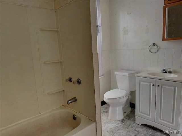 full bathroom featuring vanity, shower / bath combination, toilet, and tile walls