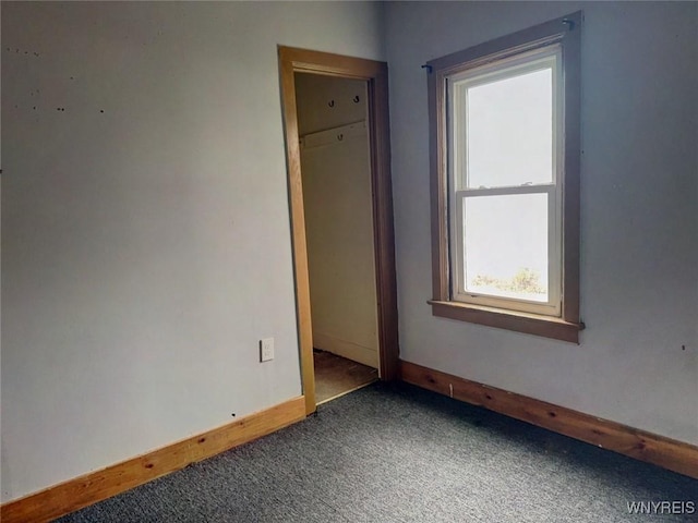 unfurnished room featuring carpet flooring