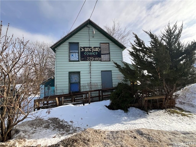 view of snow covered house