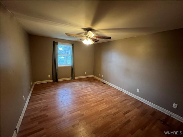 unfurnished room featuring ceiling fan and wood-type flooring