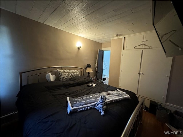 bedroom featuring dark hardwood / wood-style floors