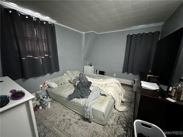 bedroom featuring crown molding