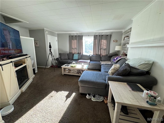 living room featuring dark carpet and ornamental molding