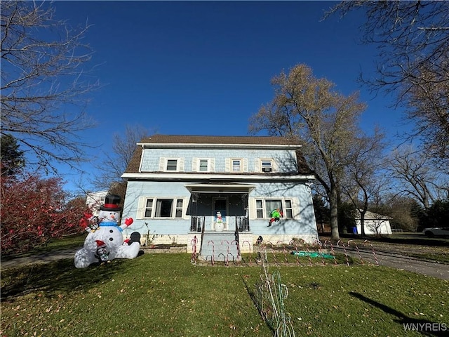 view of front of house featuring a front lawn and a porch