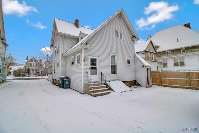 view of snow covered house