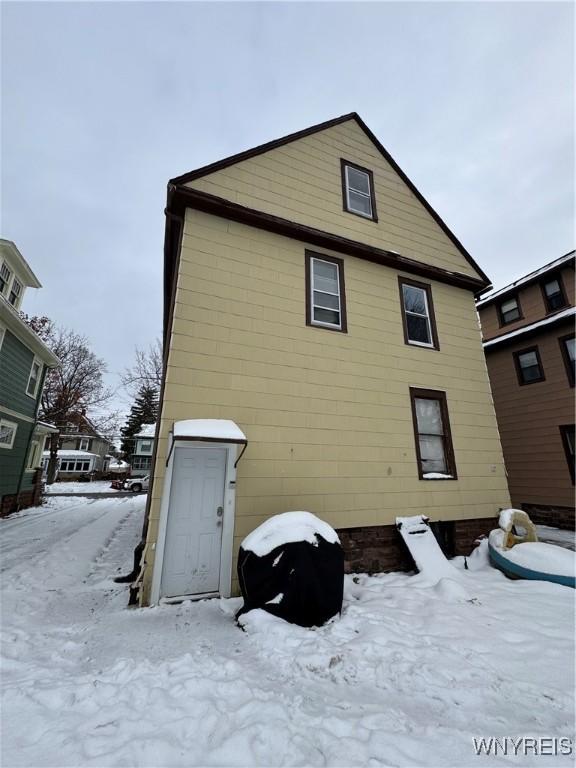 view of snow covered house