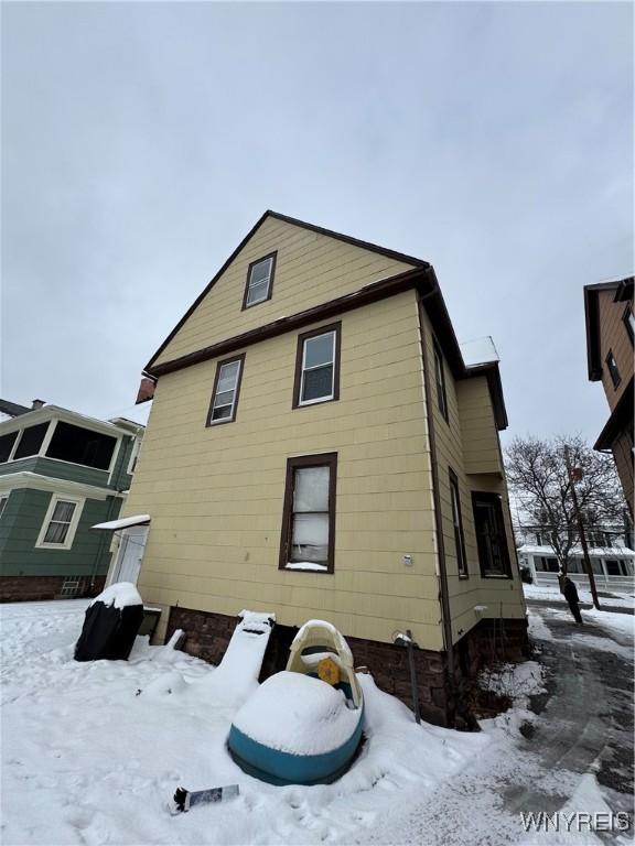 view of snow covered property