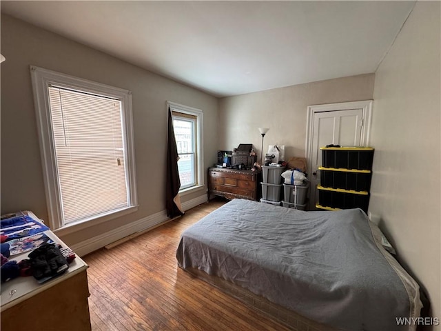 bedroom with hardwood / wood-style flooring