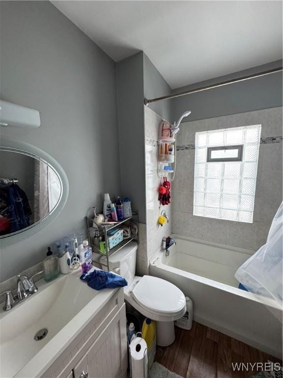 full bathroom featuring shower / bath combo, vanity, hardwood / wood-style flooring, and toilet