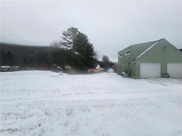 view of yard covered in snow